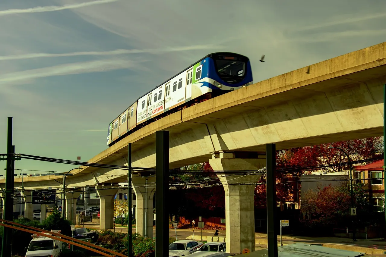 Elevated urban rail viaduct carrying a passenger train, Vancouver SkyTrain.